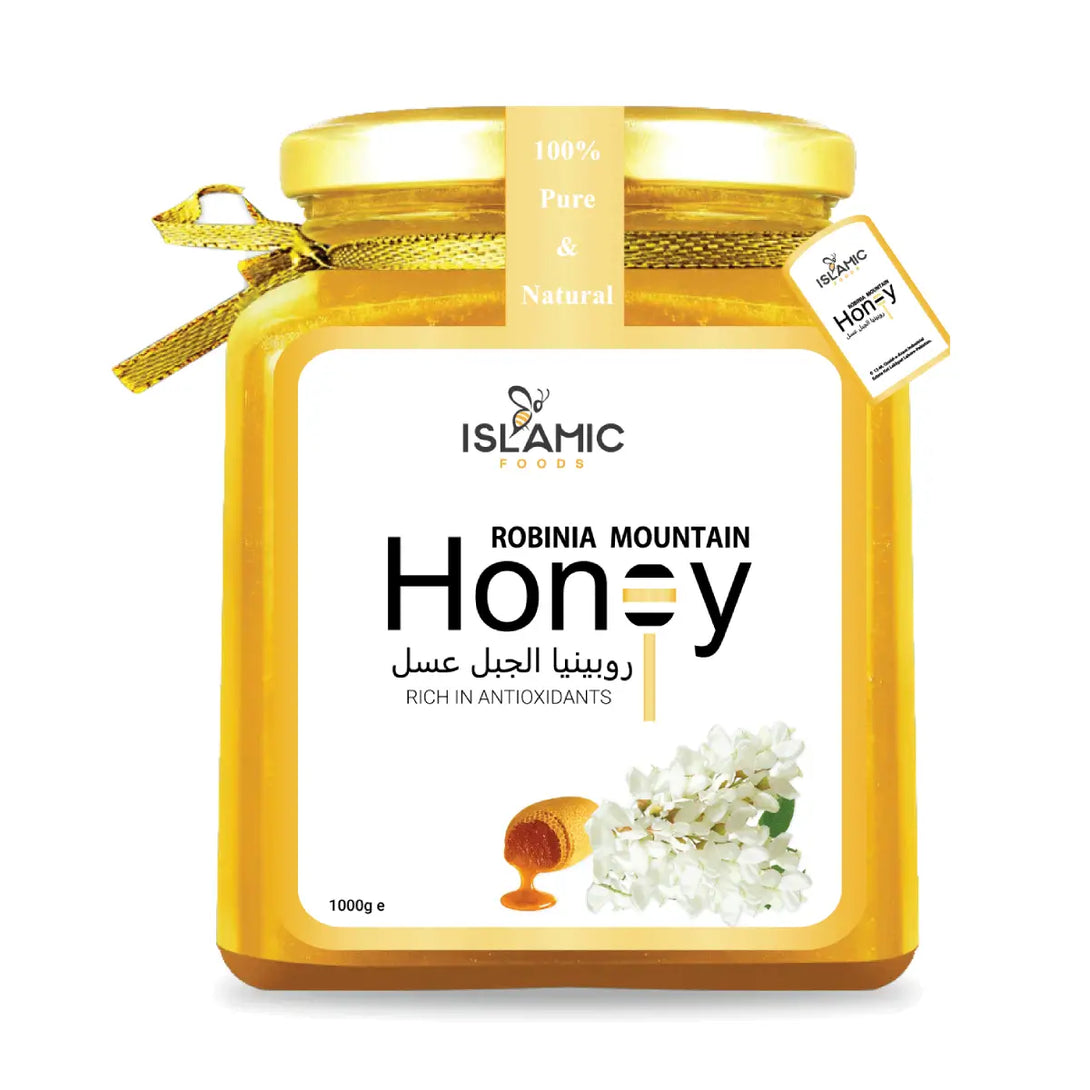 Jar of Robinia Mountain Honey with a gold lid and label on a white background